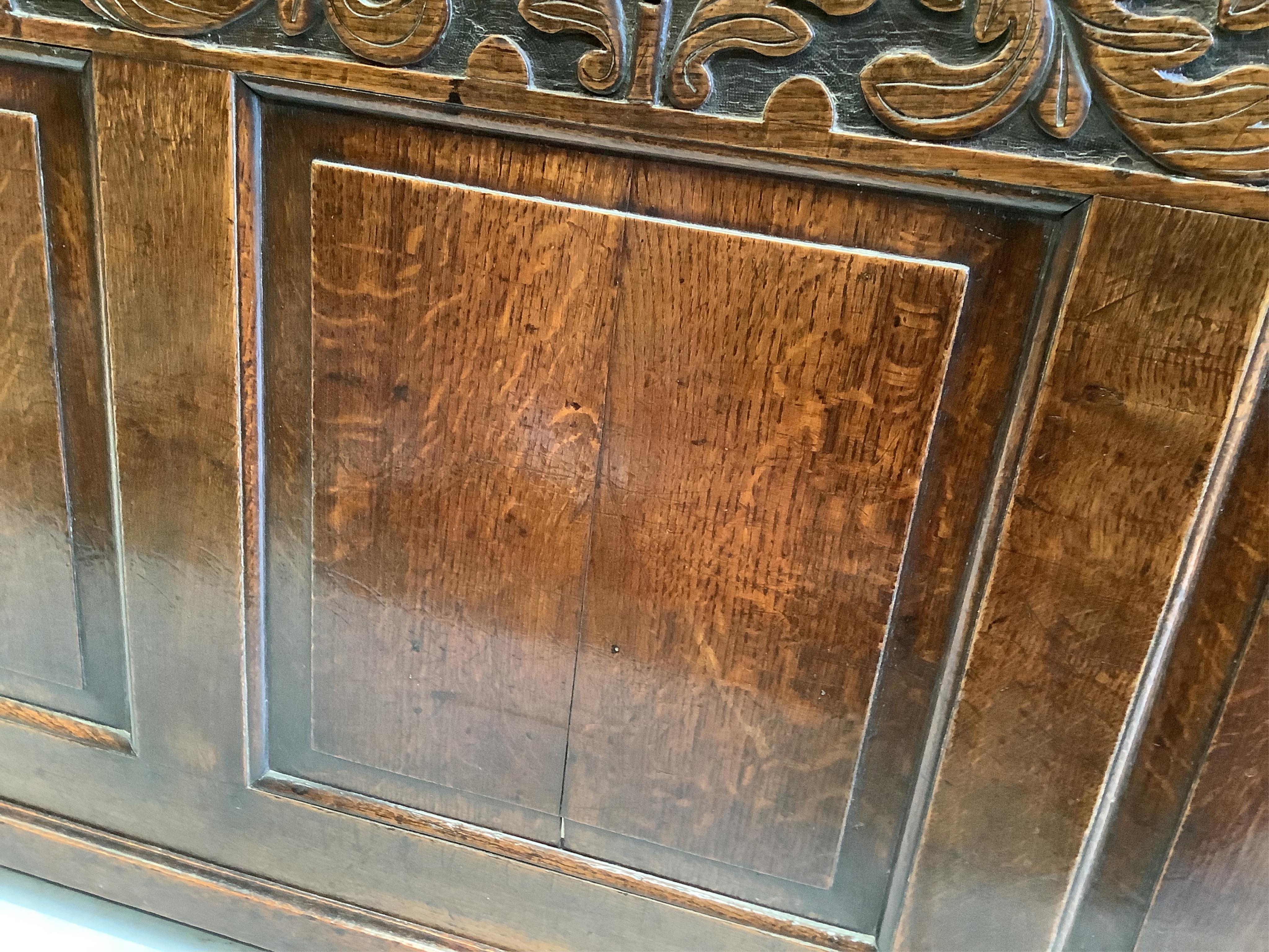An 18th century oak coffer, width 148cm, depth 52cm, height 68cm. Condition - fair